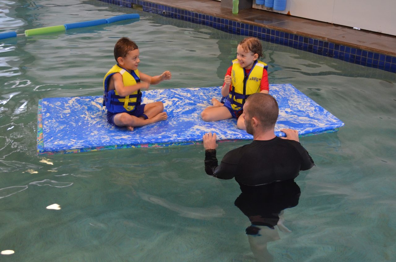 Parent and baby in a gentle swim lesson